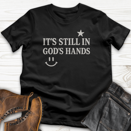 It's still in God's Hand T-Shirt