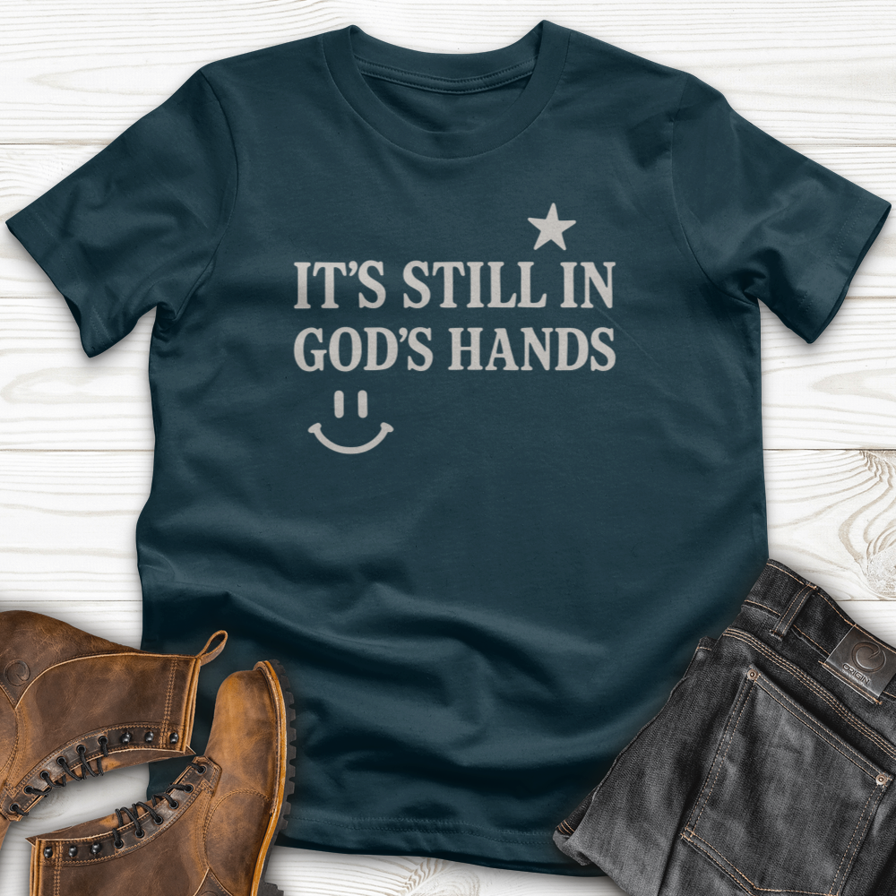 It's still in God's Hand T-Shirt