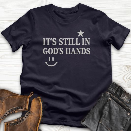It's still in God's Hand T-Shirt