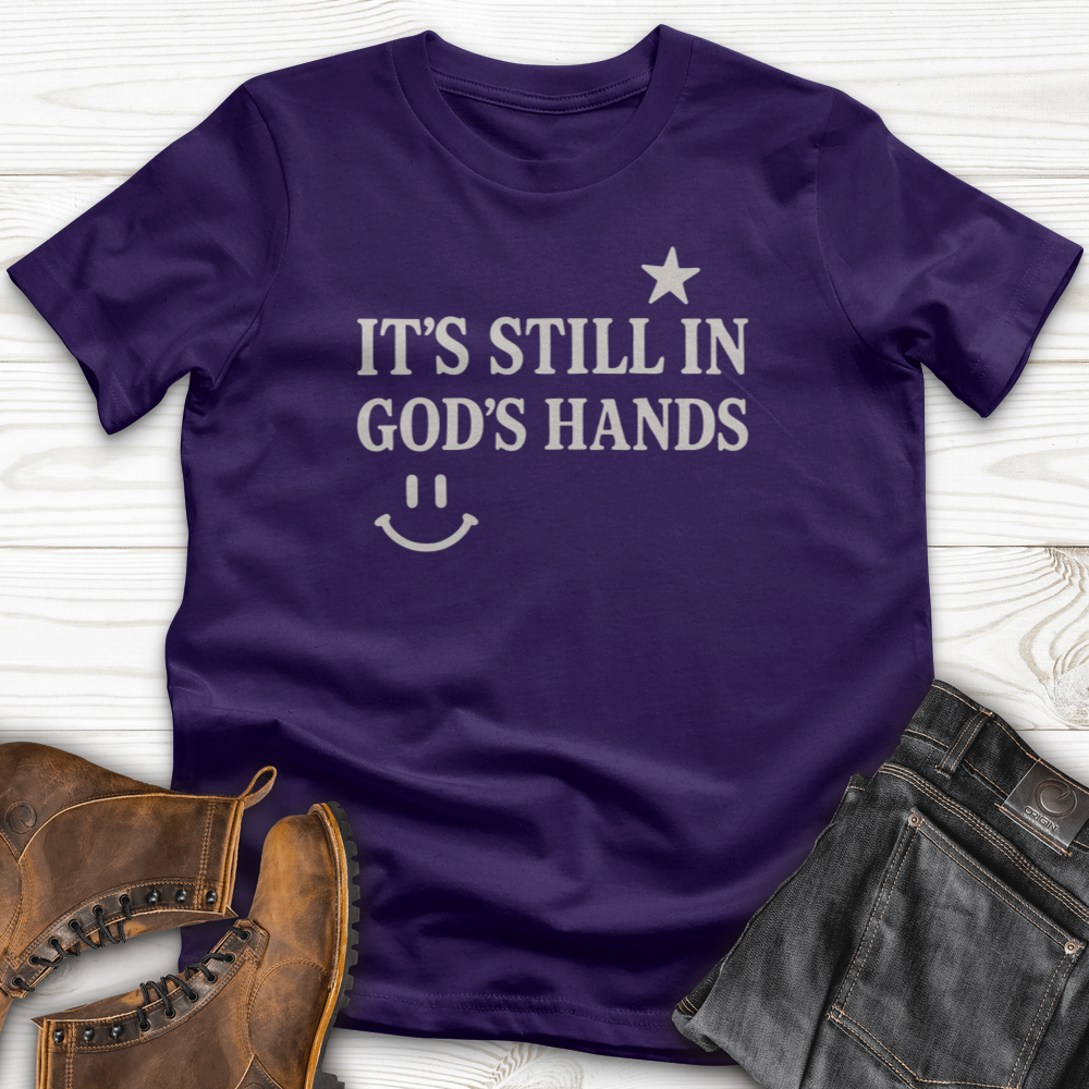 It's still in God's Hand T-Shirt